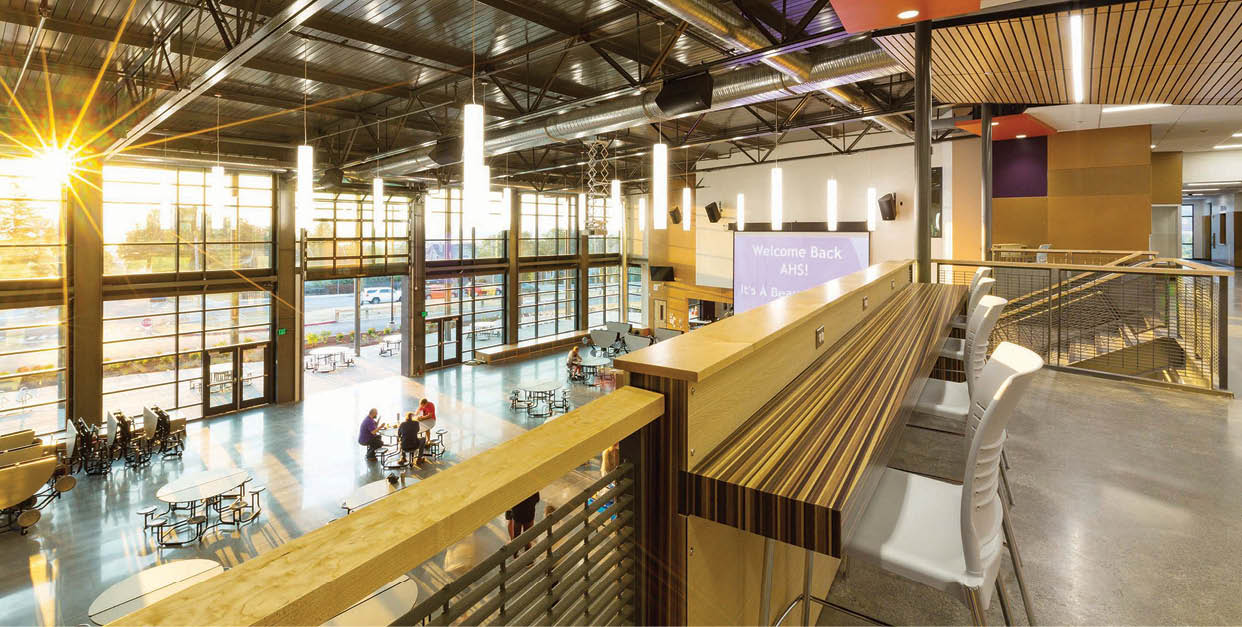 Sun beaming through the floor to ceiling windows in the Commons.