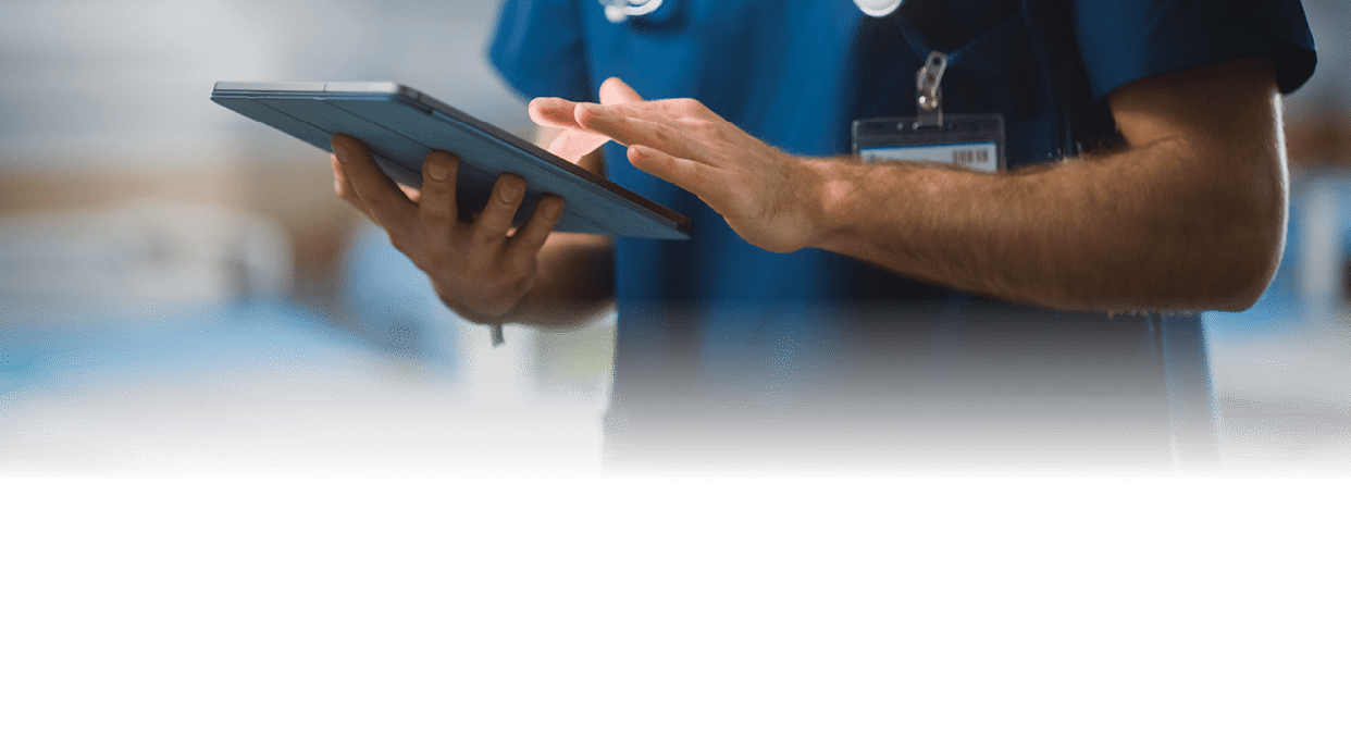 Hospital Ward: Unrecognizable Head Nurse, Doctor, Surgeon Uses Digital Tablet Computer Health Care Vitals Monitoring Computer Machine. Modern Clinic with Advanced Equipment and Professional Working