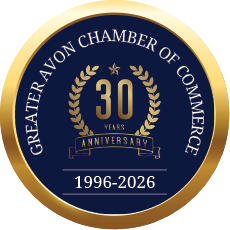 A gold and blue circle with the words “Greater Chamber of Commerce of Avon" written in the center. Description generated by AI