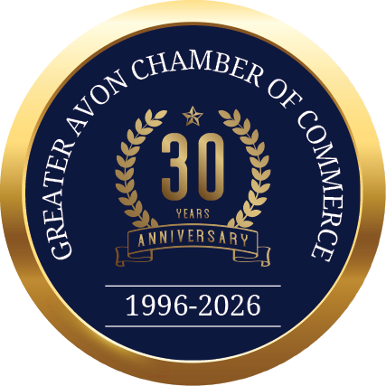 A gold and blue circle with the words “Greater Chamber of Commerce of Avon" written in the center. Description generated by AI