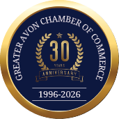 A gold and blue circle with the words “Greater Chamber of Commerce of Avon" written in the center. Description generated by AI