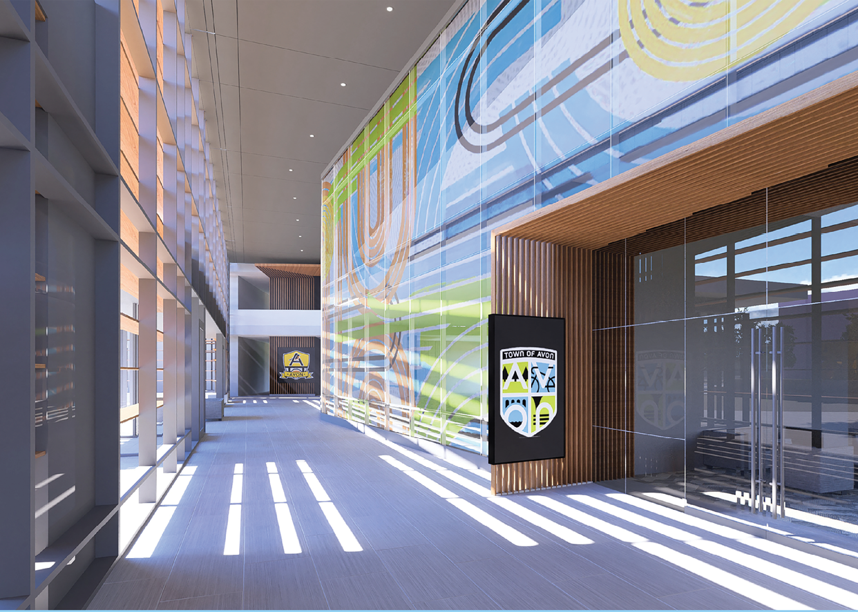 A large glass building with a blue and yellow sign on the wall. Description generated by AI