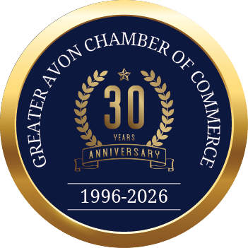 A gold and blue circle with the words “Greater Chamber of Commerce of Avon" written in the center. Description generated by AI