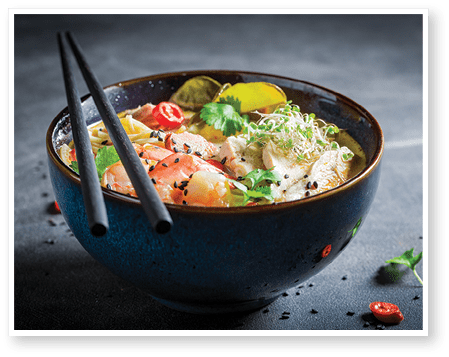 Yummy Malaysian Soup made of coconut milk and shrimps. Classic Malaysian soup with vegetables and meat.