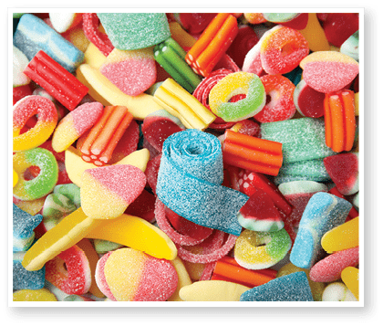 Tasty colorful jelly candies as background, above view