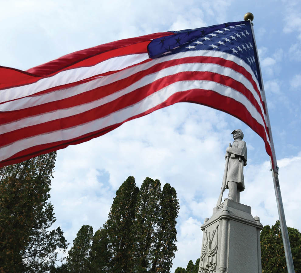 An American flag flies on Memorial Day at the Evergreen Cemetery in Barrington.