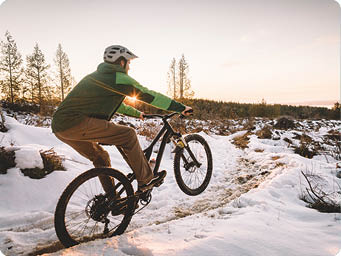 Photographer and local athlete Evan Skoczenski captures a photo of himself biking up Galbraith after a winter storm