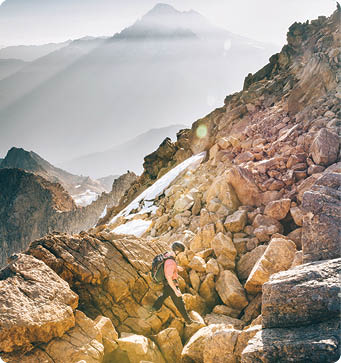 North Bennet makes his way through a boulder field on the way up the North Twin sister