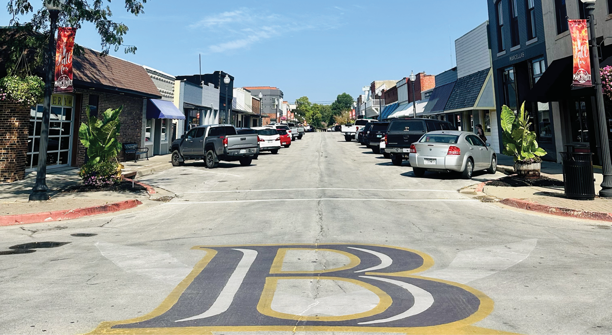 A street with a yellow B on it. Description generated by AI
