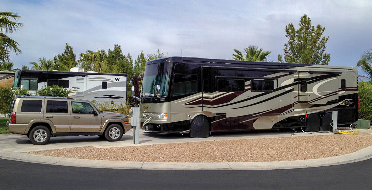 Las Vegas, Nevada, USA. February 23, 2017 Two motorhomes in a public campground with a Jeep parked in front.