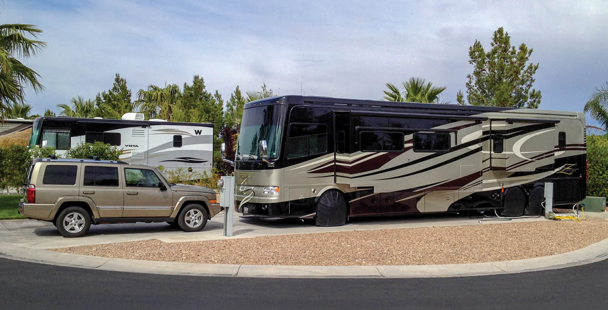 Las Vegas, Nevada, USA. February 23, 2017 Two motorhomes in a public campground with a Jeep parked in front.