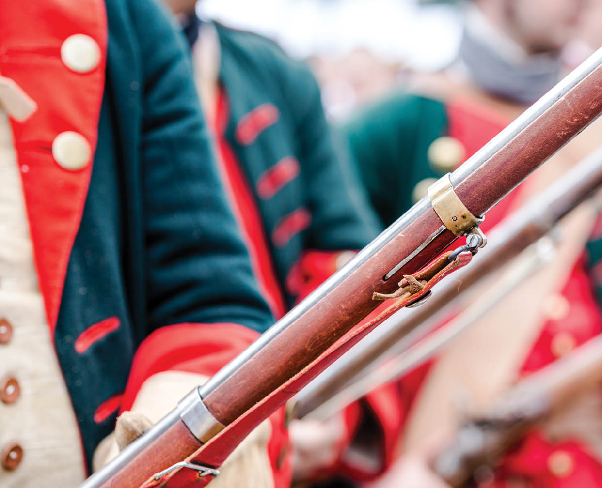 A group of people dressed in red and green uniforms holding rifles. AI generated content