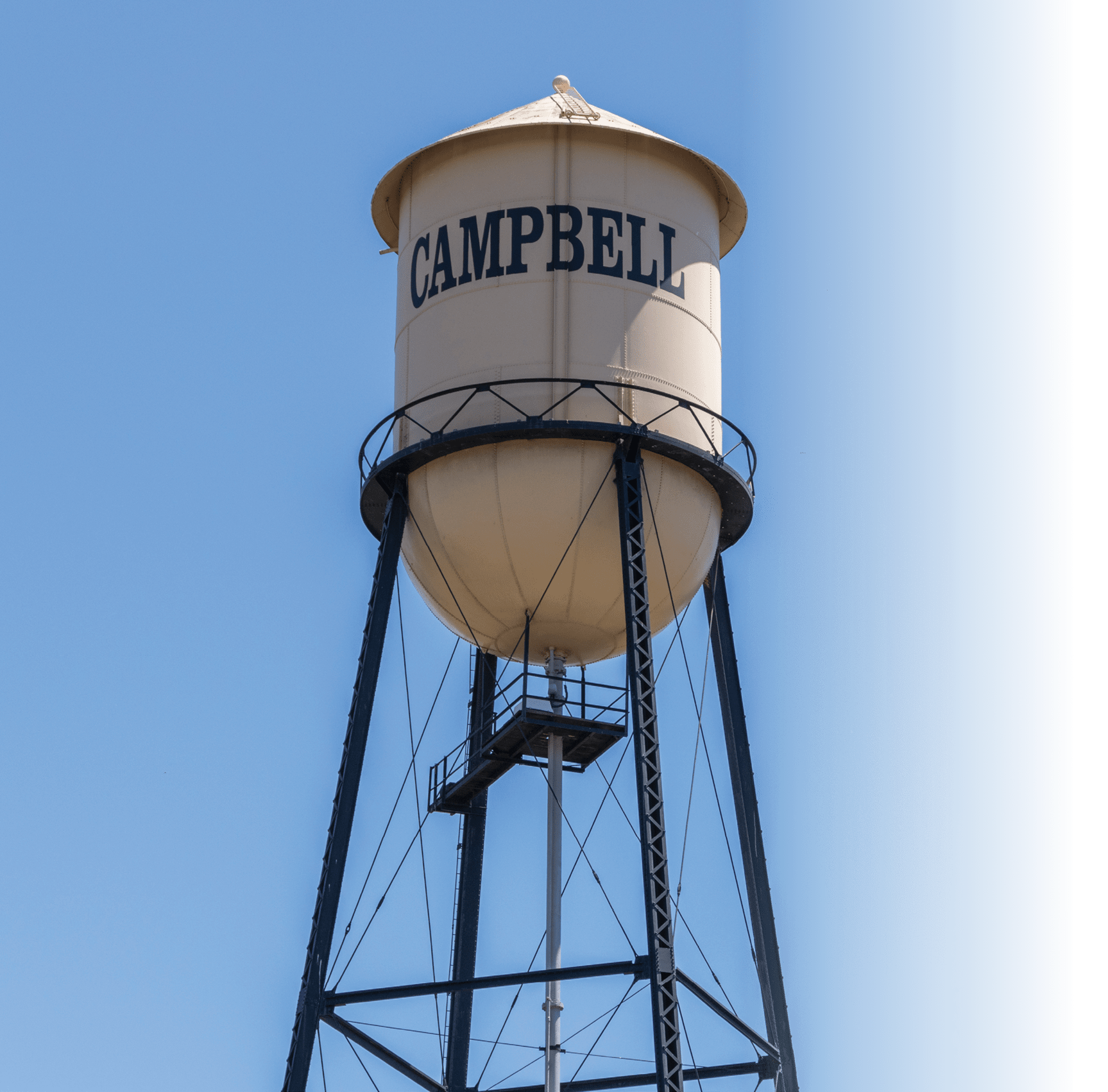 Campbell Water Tower against a blue summer sky. City of Campbell, Northern California.
