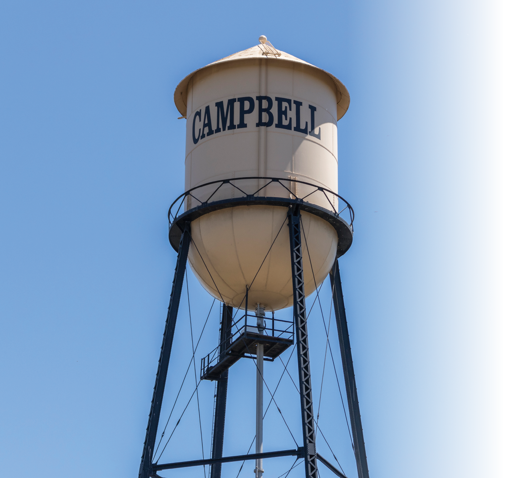 Campbell Water Tower against a blue summer sky. City of Campbell, Northern California.