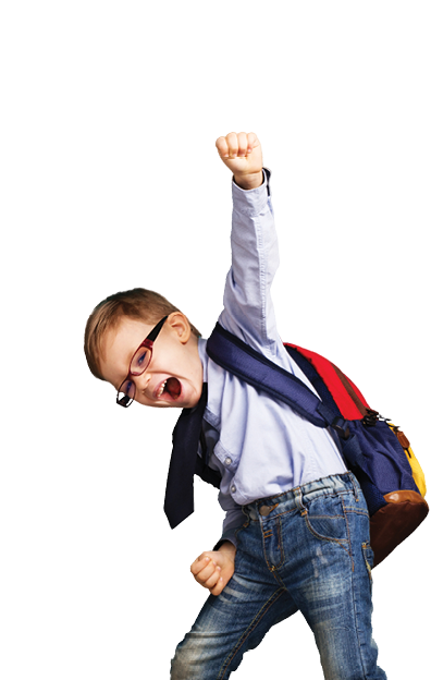 Cheerful smiling little boy with big backpack jumping and having fun against blue wall. Looking at camera. School concept. Back to School