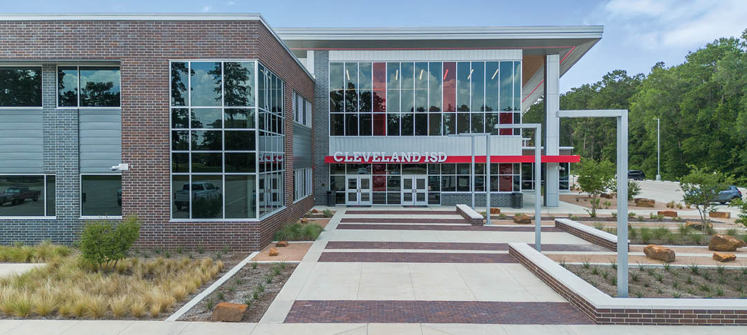 A large building with many windows and a red awning. AI generated content