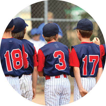Little League players standing in line before a game.