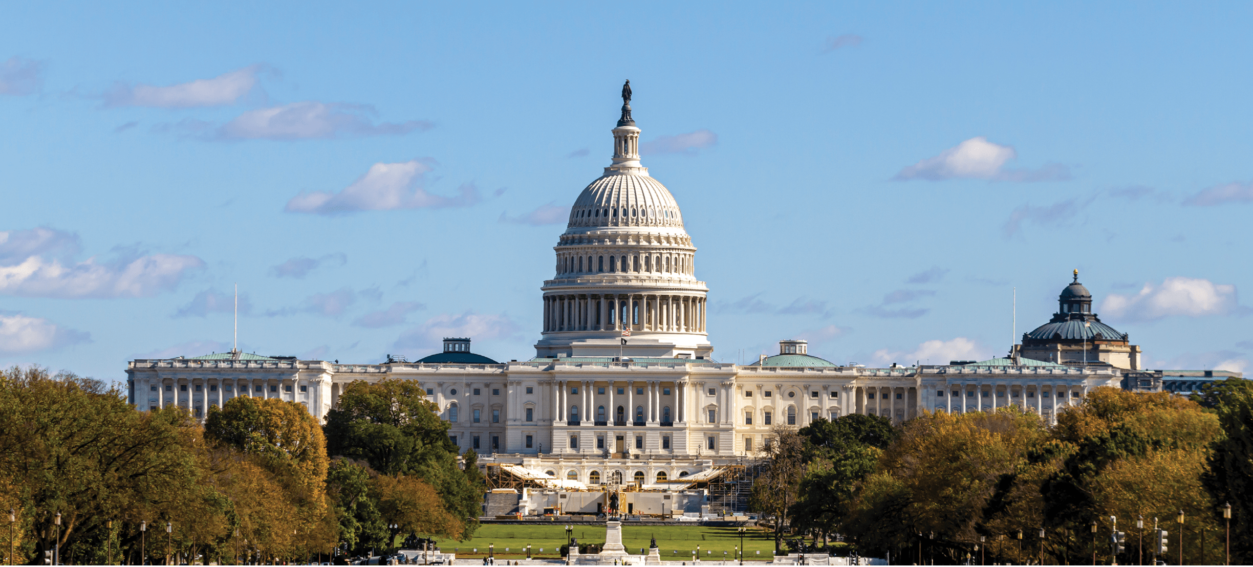 Panoramic image of the US Capitol building in Washington DC as seen from national mall This iconic place holds senate and congress. It is a sunny autumn day and clear sky with a few clouds