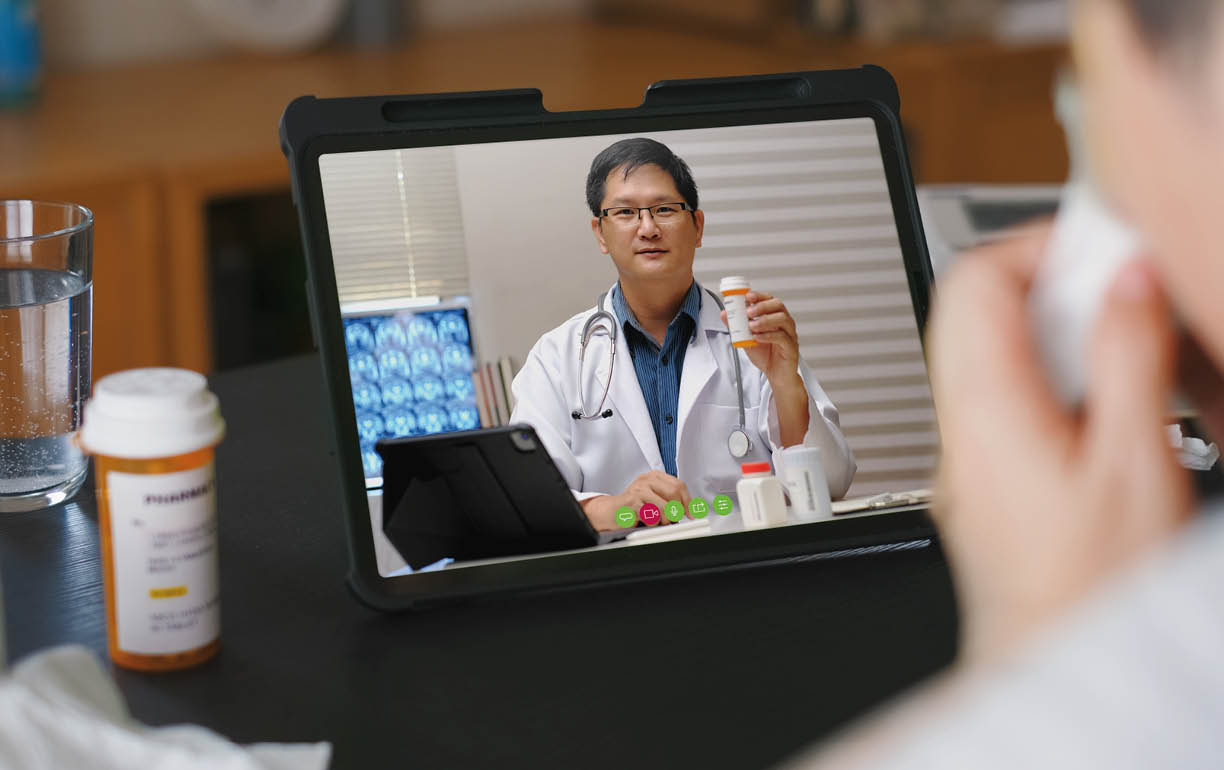 Telehealth concept,asian woman video call with her doctor about fever illness while staying at home. Close up of patient about illness in video conferencing with general practitioner on digital tablet.