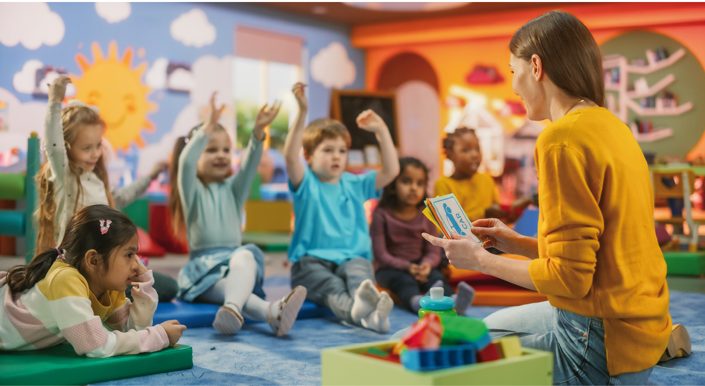 Cheerful Preschool Educator Playing and Creatively Studying with Multiethnic Kids in Kindergarten. Small Adorable Children Getting Basic Reading and Writing Skills, Learning Alphabet