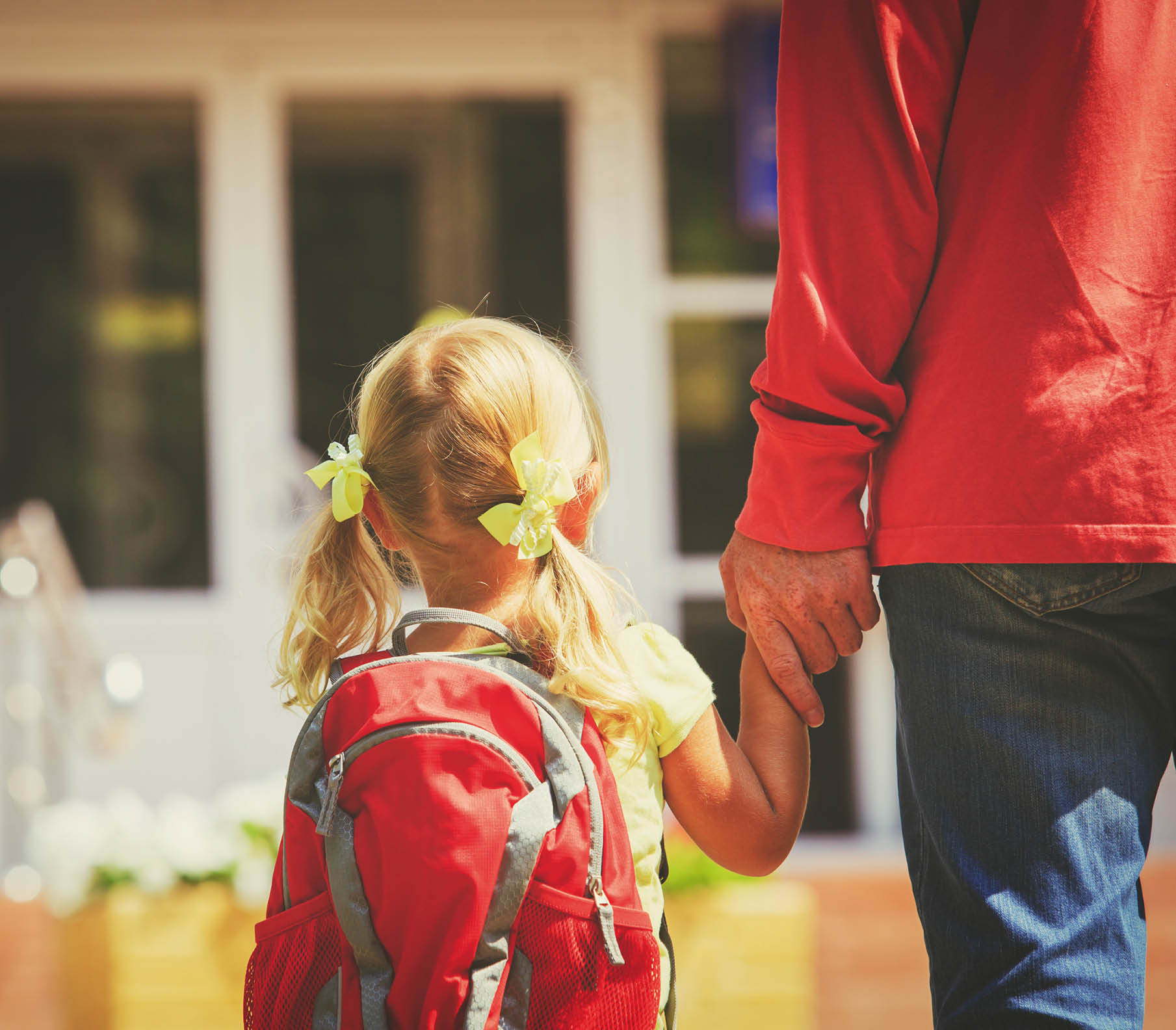 father and little daughter go to school or daycare, education