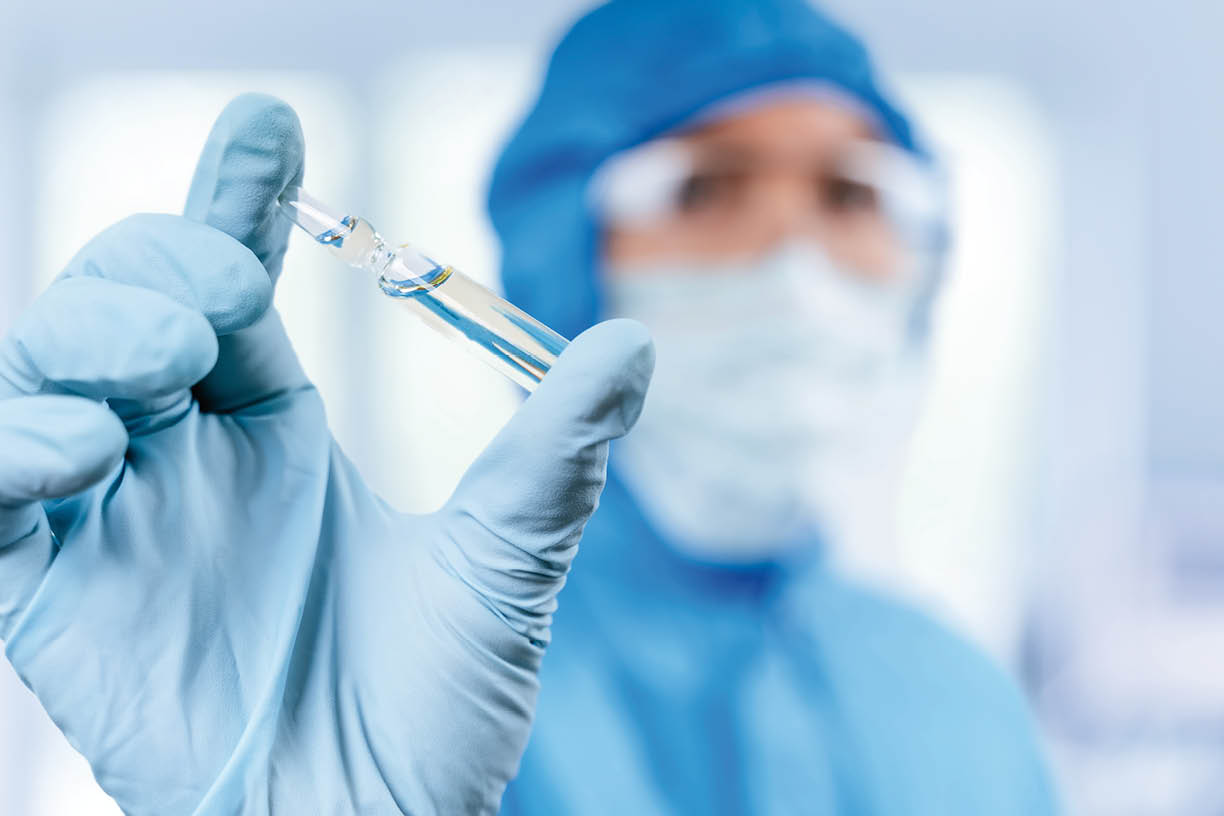 Medical doctor or laborant holding tube with nCoV Coronavirus vaccine for 2019-nCoV virus  Novel Coronavirus originating in Wuhan, China  Coronavirus 2019-nCoV concept 