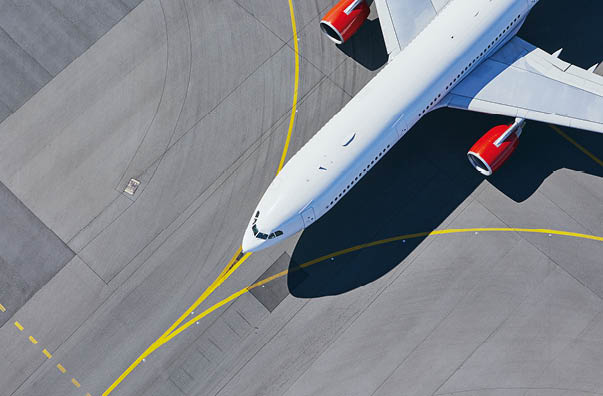 Aerial view of airport  Airplane taxiing to runway before take off 