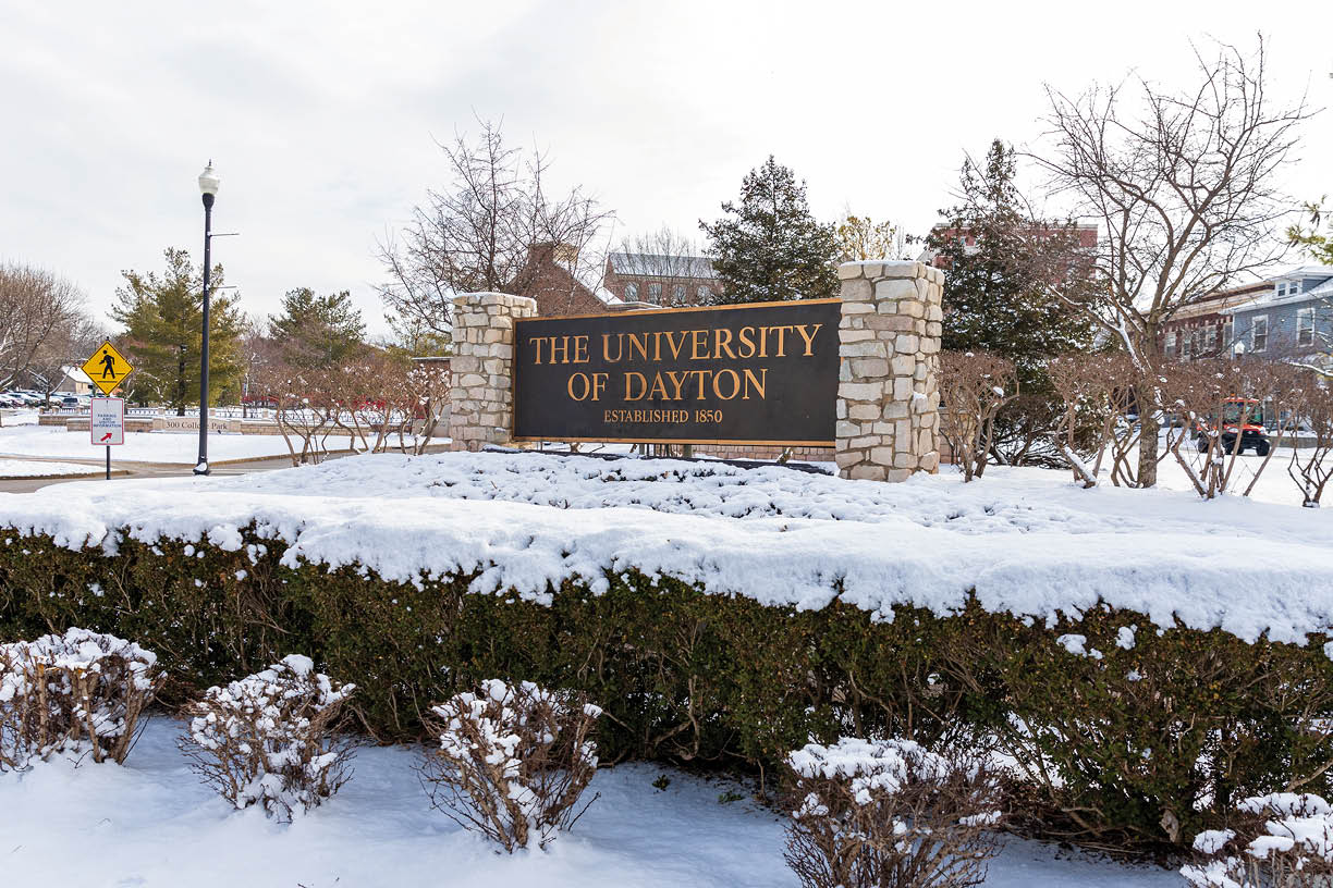 Dayton, OH, USA   February 28, 2020: University of Dayton sign, with fresh winter snow on the ground 