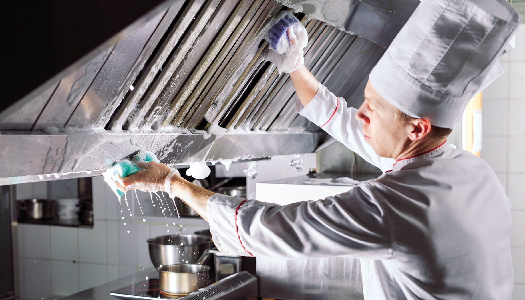 Sanitary day in the restaurant. Repeats wash your workplace. Cooks wash oven, stove and extractor in the Restaurant