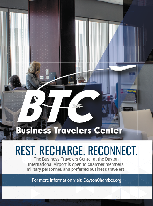 A business travelers center advertisement with a woman sitting at a desk. AI generated content