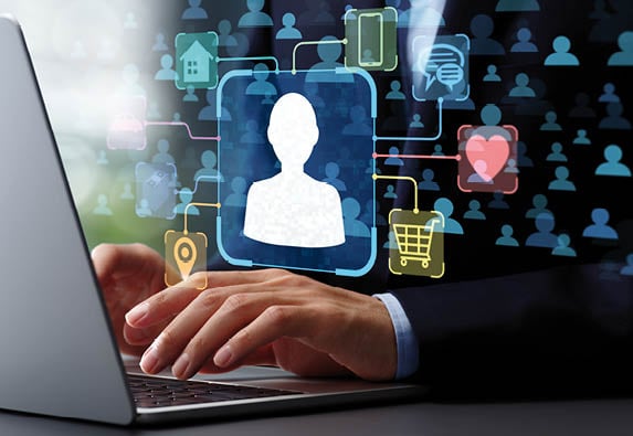 A person is using a laptop with a graphic of a person on the screen. AI generated content