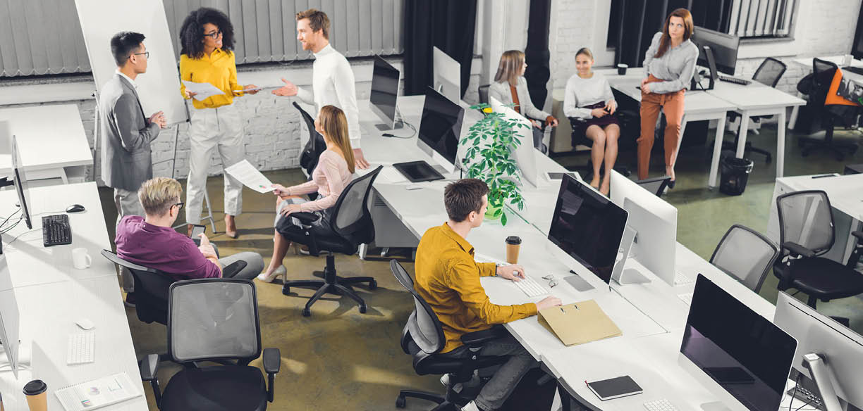 high angle view of professional young business colleagues working together in open space office   