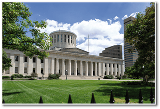 The Ohio Statehouse and accompanying park, located in Columbus, Ohio. Pictured on a bright, sunny day.