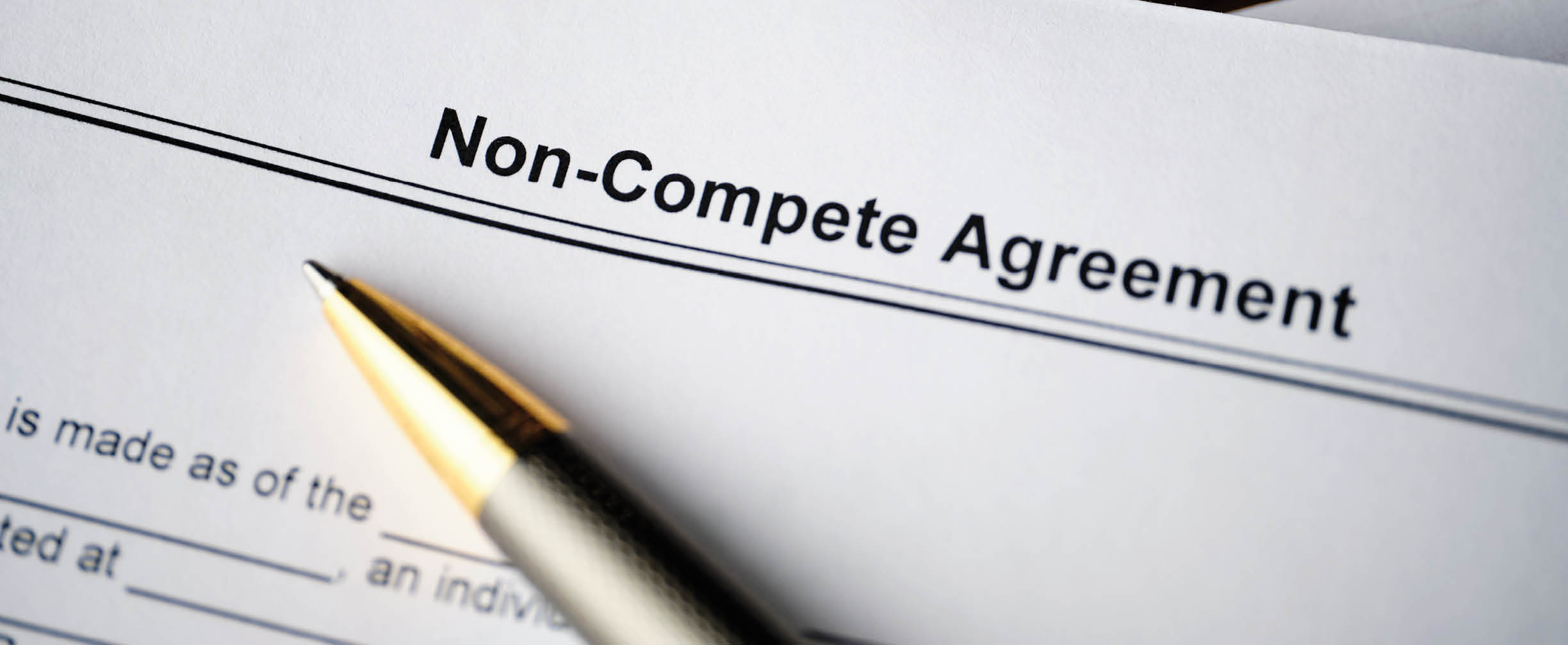 Legal document Non-Compete Agreement on paper close up.