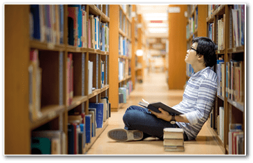 Young Asian man university student reading book in library, education research and self learning in university life concepts