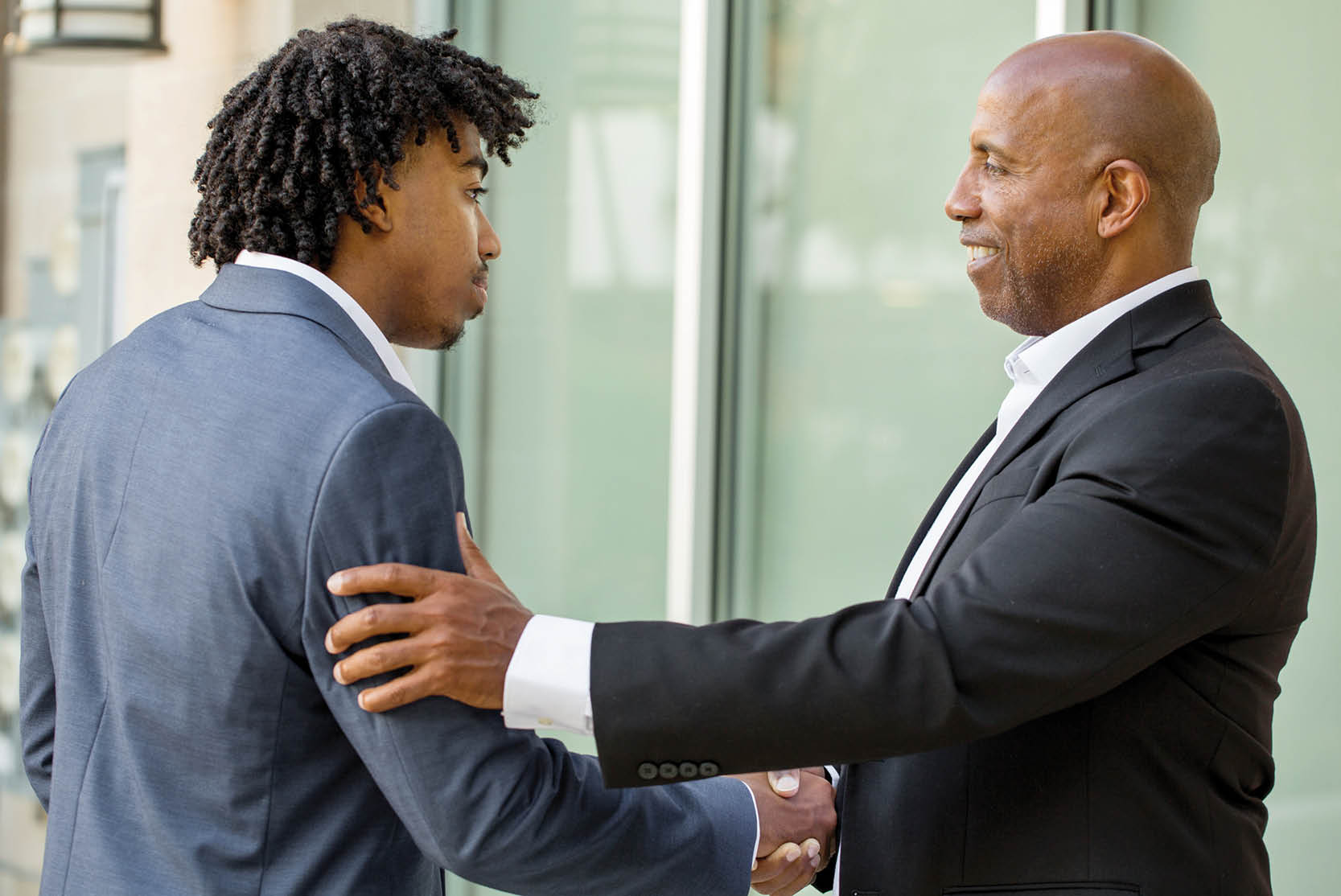 Mature African American Businessman smiling.