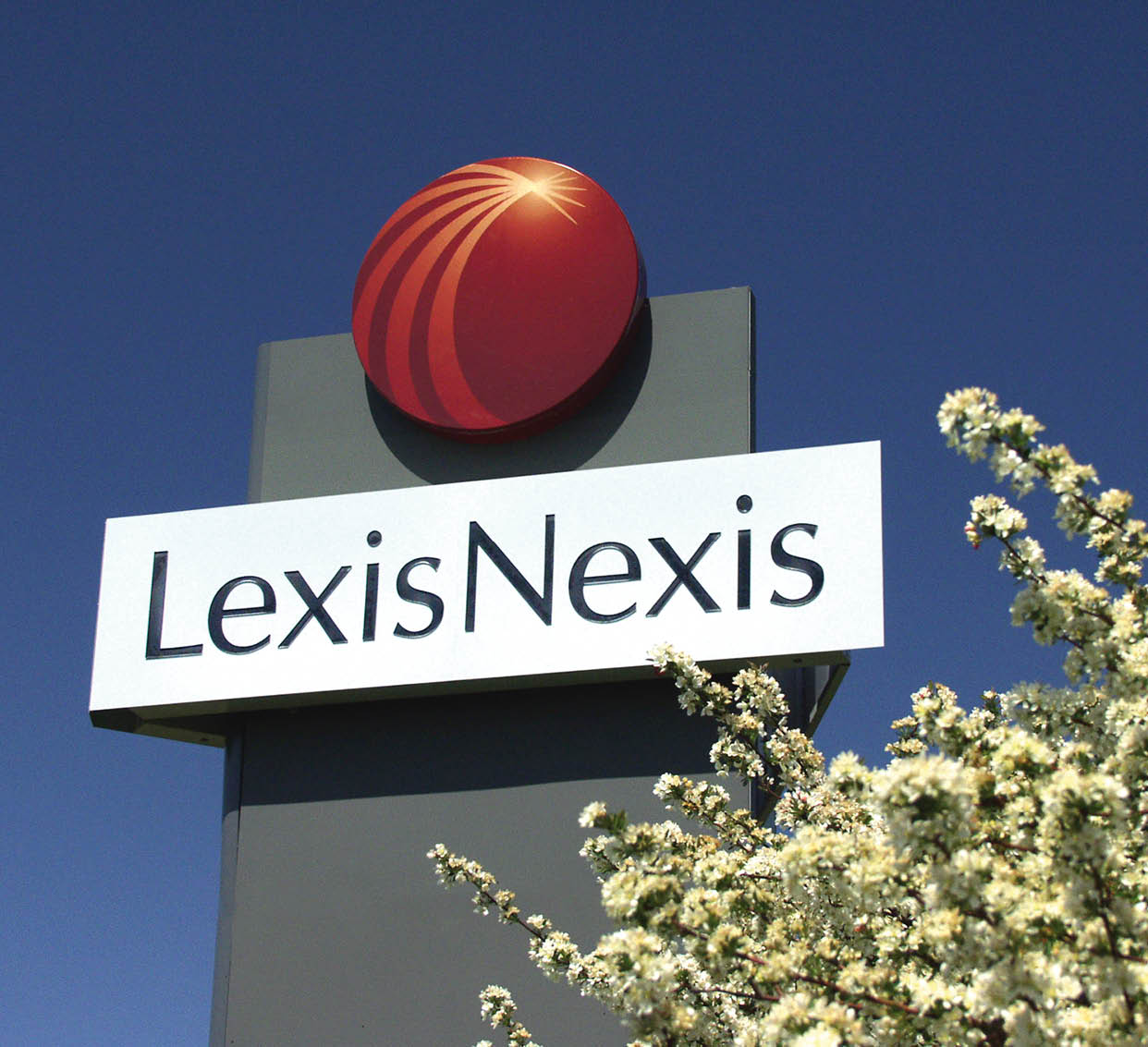 A sign for Lexis Nexis with a red logo. Description generated by AI