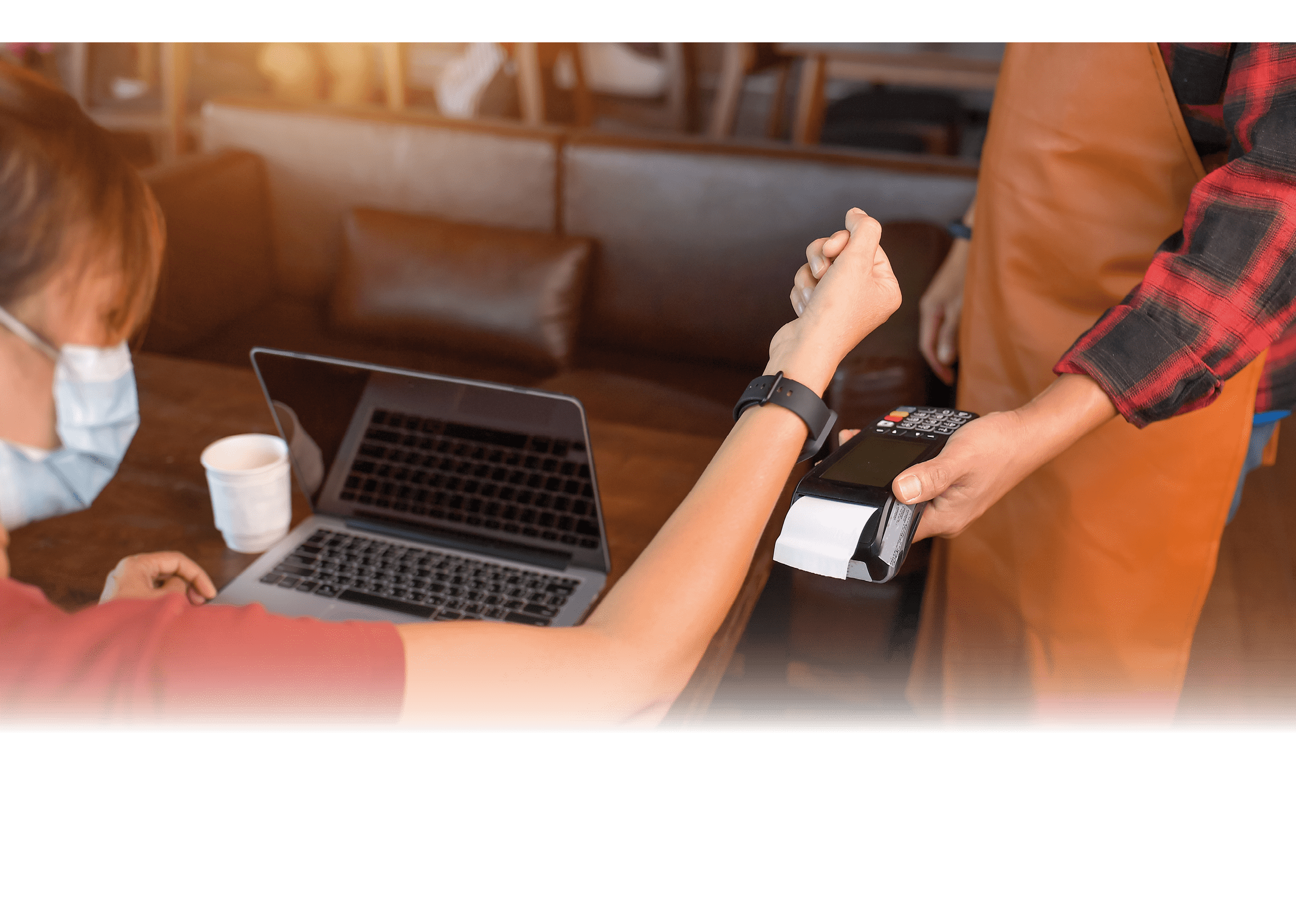 Customer making wireless or contactless payment using smartwatch  Store worker accepting payment over nfc technology shallow depth of field