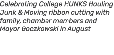 Celebrating College HUNKS Hauling Junk & Moving ribbon cutting with family, chamber members and Mayor Goczkowski in A...