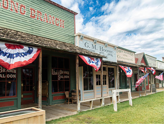 A row of buildings with flags hanging from them. AI generated content