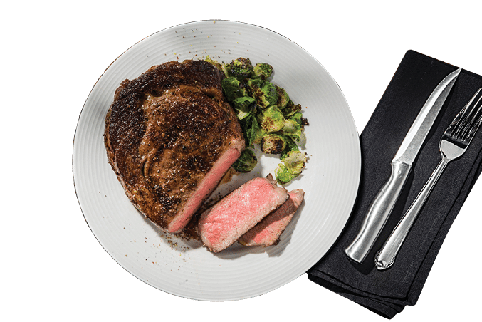 A plate of food with a steak, broccoli, and a side of meat. A fork and knife are placed on the table. AI generated content
