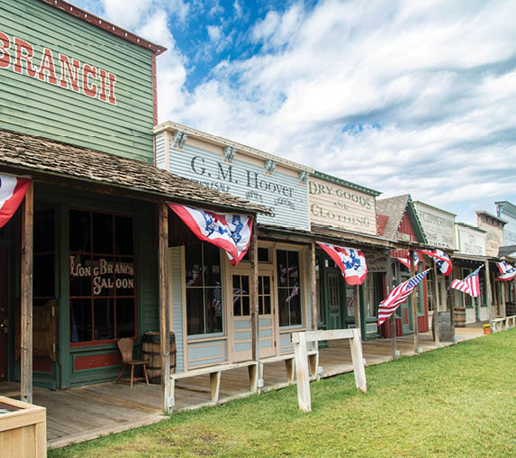 A row of buildings with flags hanging from them. AI generated content