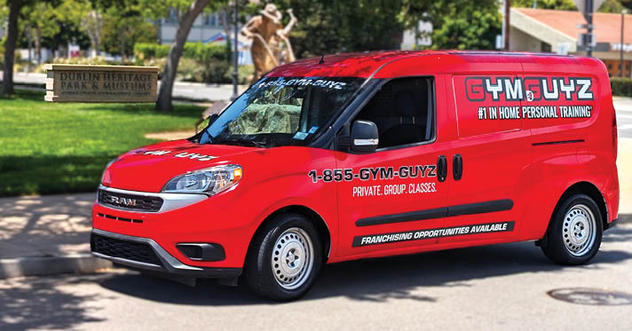 A red van with a large logo on the side is parked on the side of the road. AI generated content