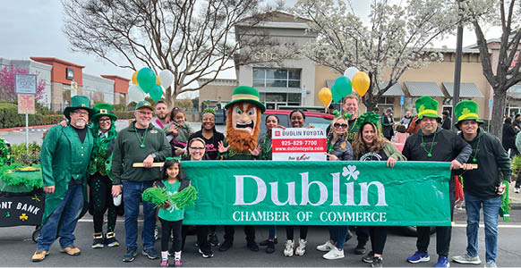 A group of people dressed in green and holding signs with the word Dublin on them. AI generated content