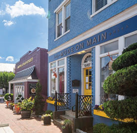 A blue and white building with a sign that says 400 on main. Description generated by AI