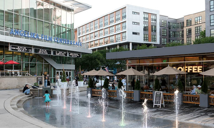 A fountain with water spraying up in the air. Description generated by AI