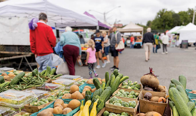 A variety of vegetables are displayed in baskets. Description generated by AI