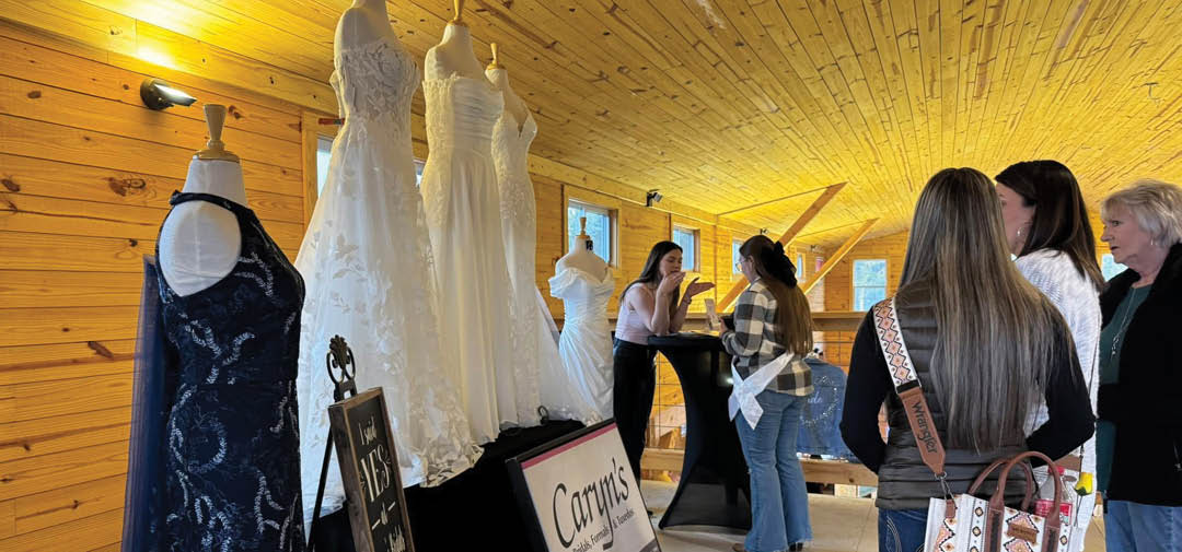 A group of people are standing in a room with a display of wedding dresses. AI generated content