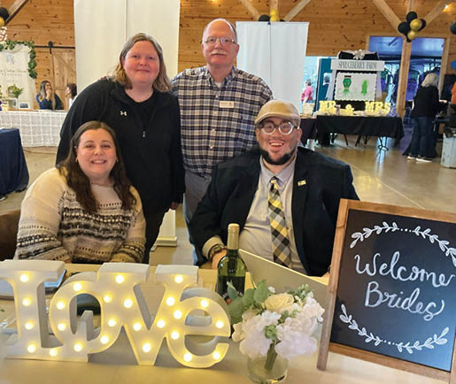A group of people are standing in front of a sign that says “welcome brides". AI generated content