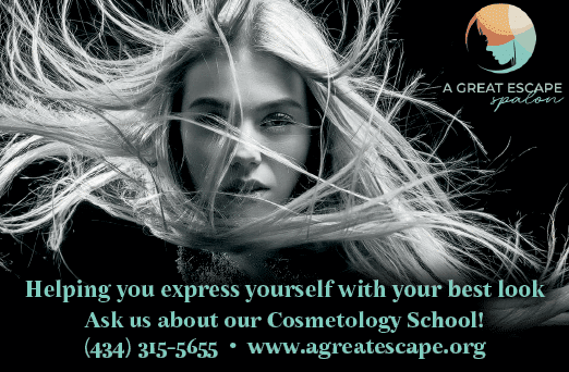 A woman with blonde hair and a ponytail is shown with her hair blowing in the wind. She is looking at the camera. The image is used to advertise a cosmetology school. AI generated content